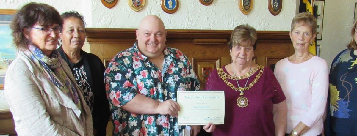 photo of Roger Strange Burlong Receiving Award