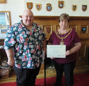 thumbnail photo of roger Strange Burlong receiving award