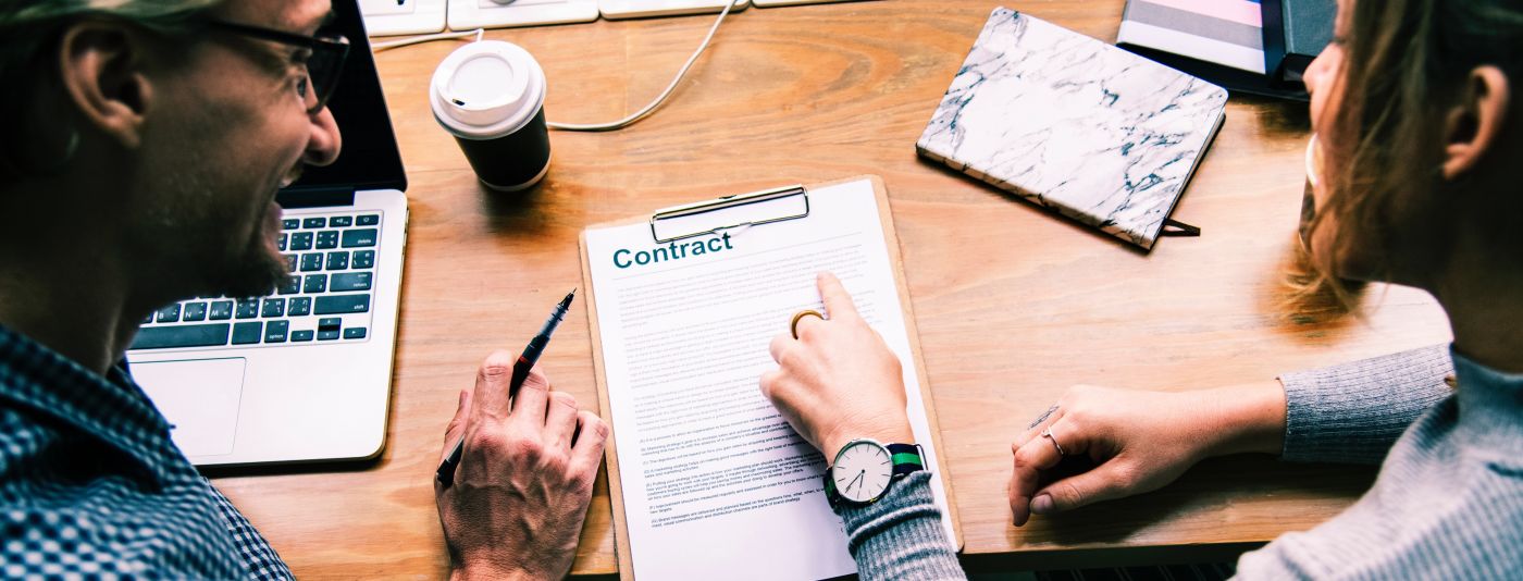 photo of employer at desk with carer