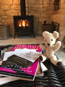 after umbrage teddy in cottage by fireplace