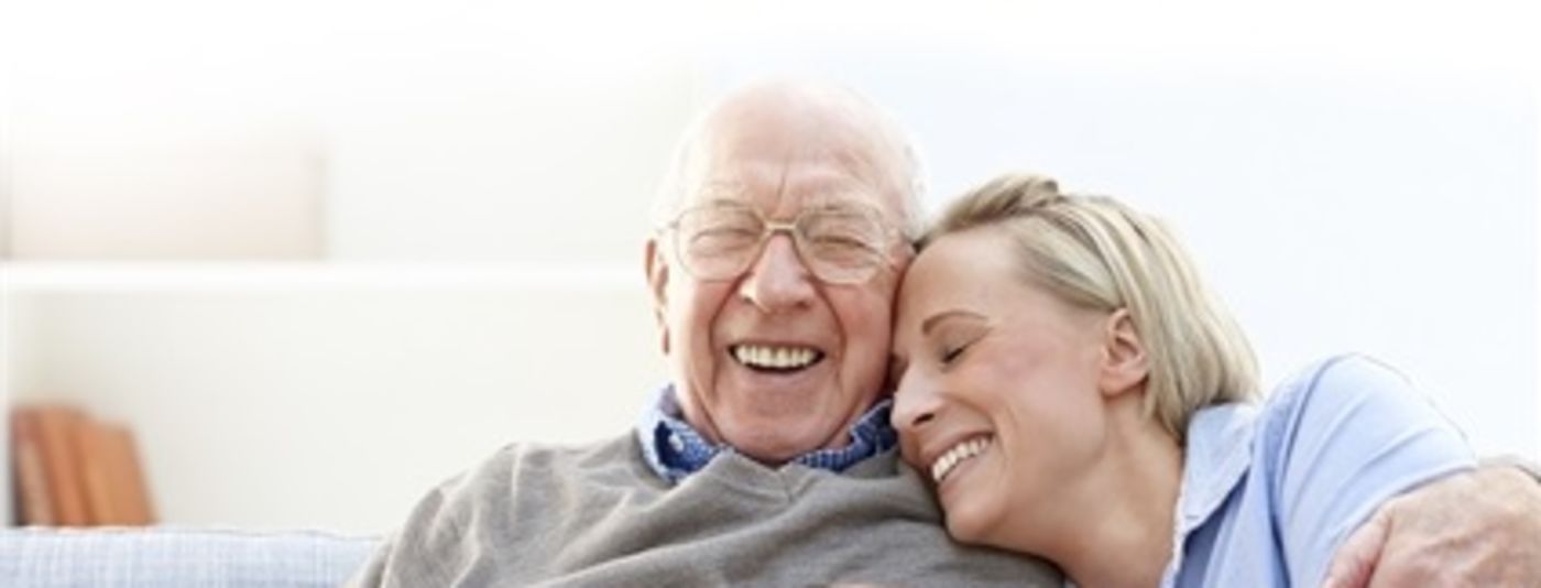 photo of grandfather and carer laughing