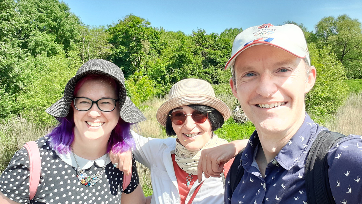 A self taken photograph of two female carers posing for a photograph with a member of staff from Care for the Carers while on a walk.