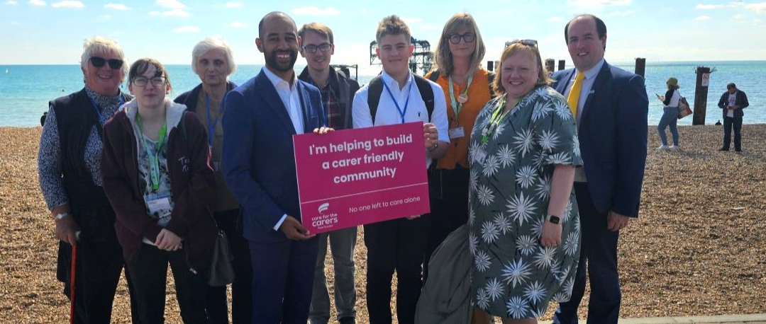 Josh Babarinde MP with carers and Care for the Carers staff on Brighton seafront