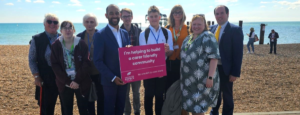 Josh Babarinde MP with carers and Care for the Carers staff on Brighton seafront