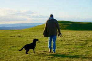 Man with dog outdoors