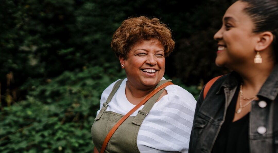 Two women talking and smiling