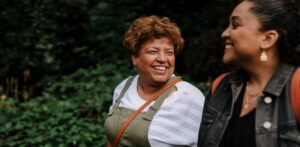 Two women talking and smiling